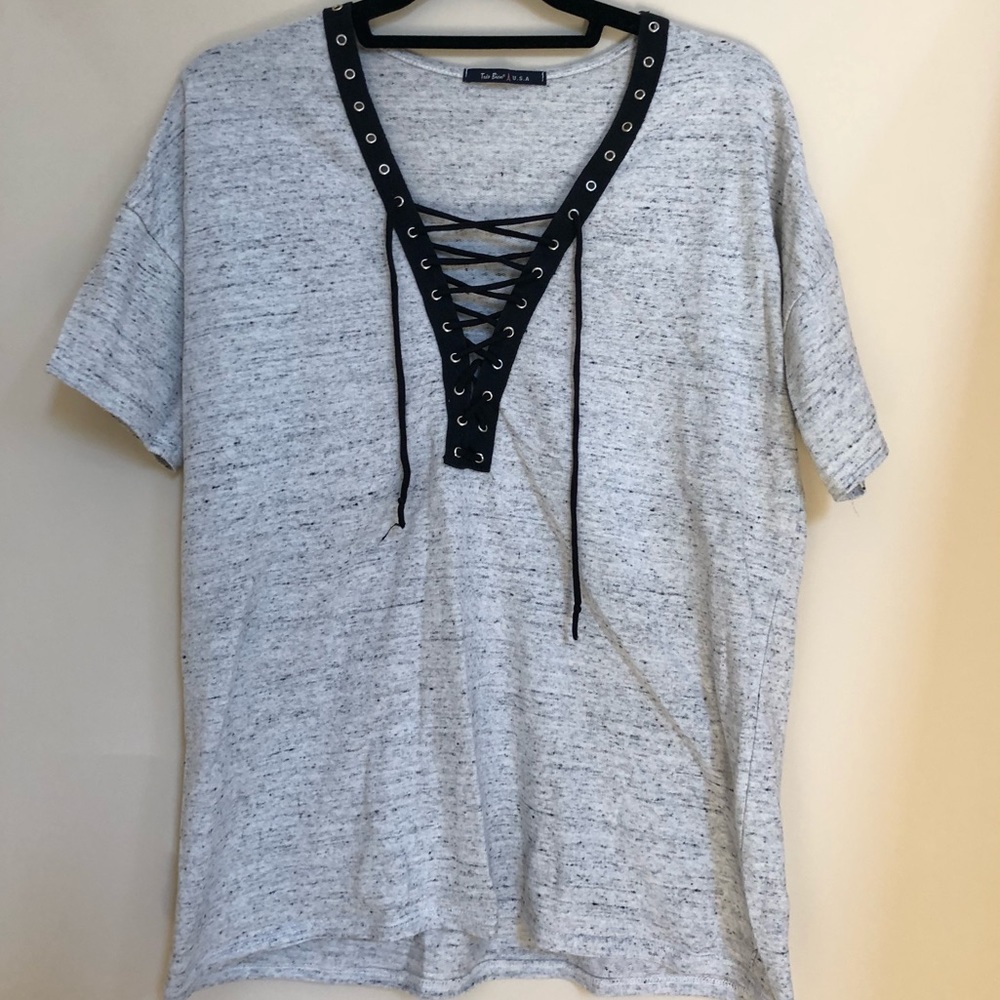 Grey shirt sleeve with black lace up ties